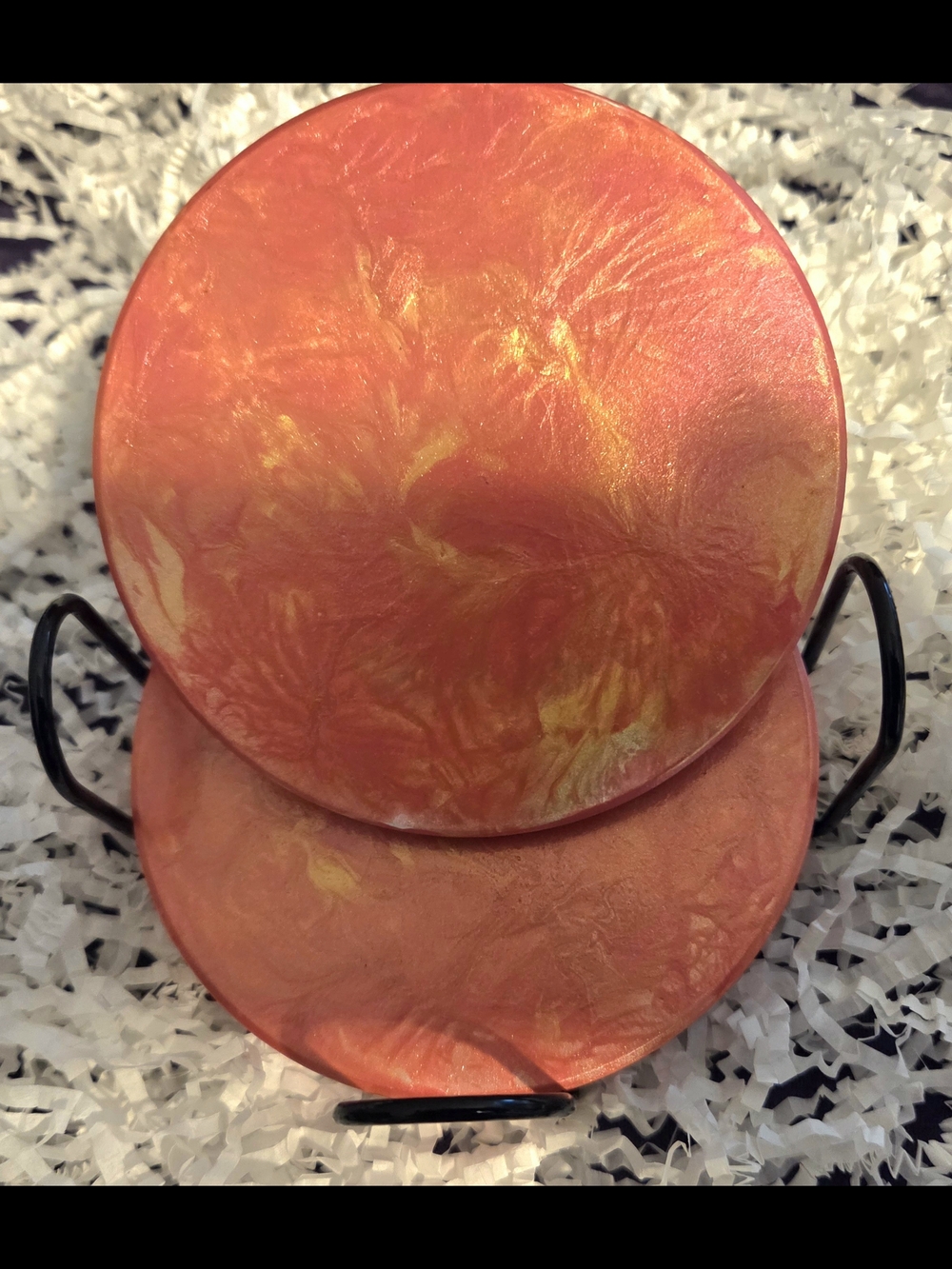 Hand Painted Ceramic Coasters In An Orange and Gold Marbled Pattern.